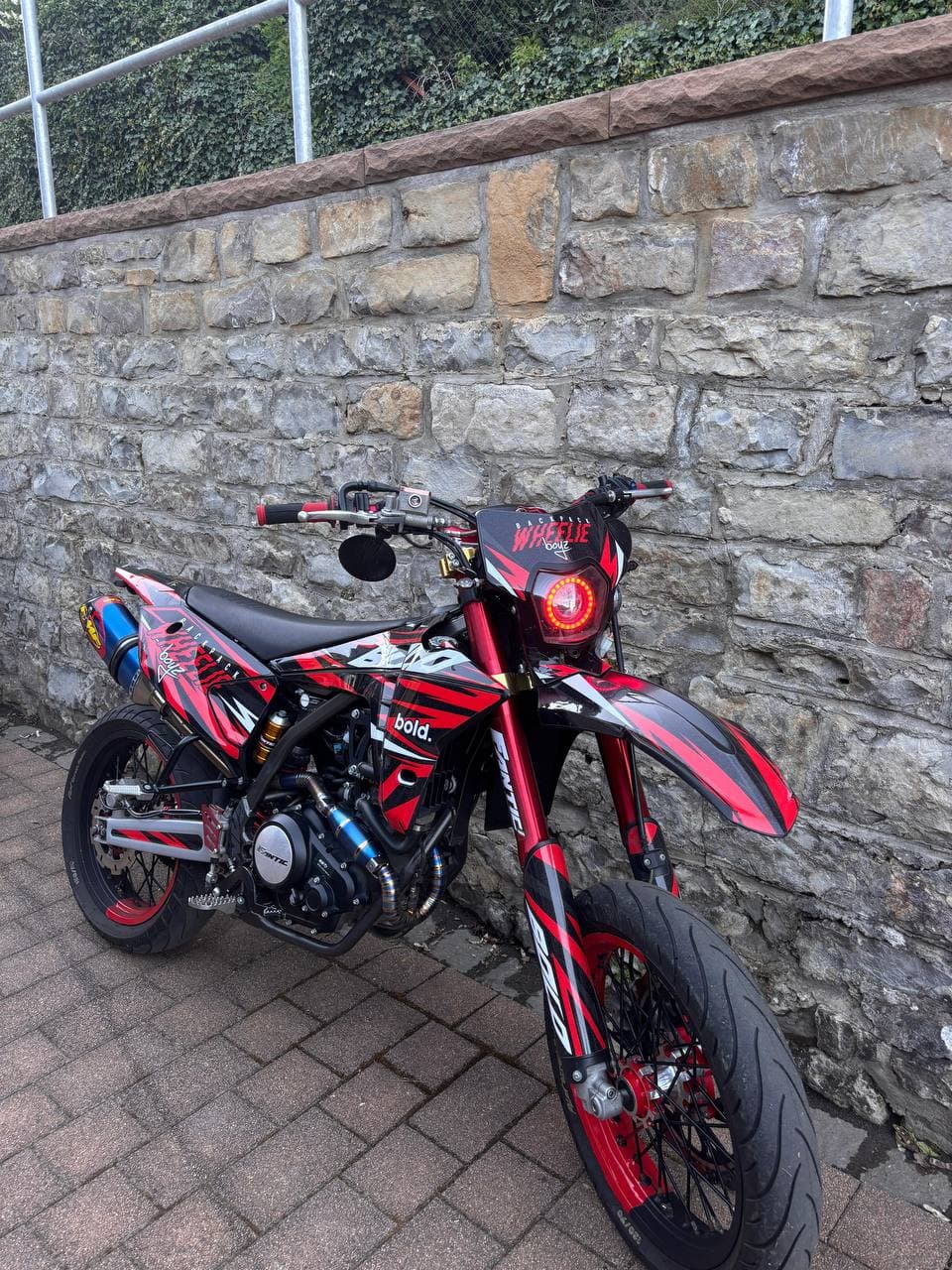 Fantic XMF 125 in red with Wheelie graphics