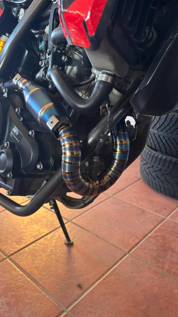 Handmade titanium exhaust manifold with rainbow heat colors